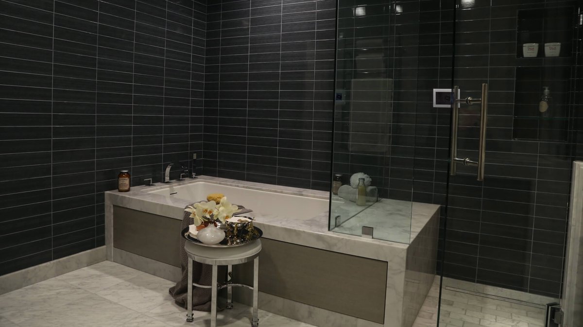 Glass steam shower with a Mr.Steam iSteamX control in a modern bathroom