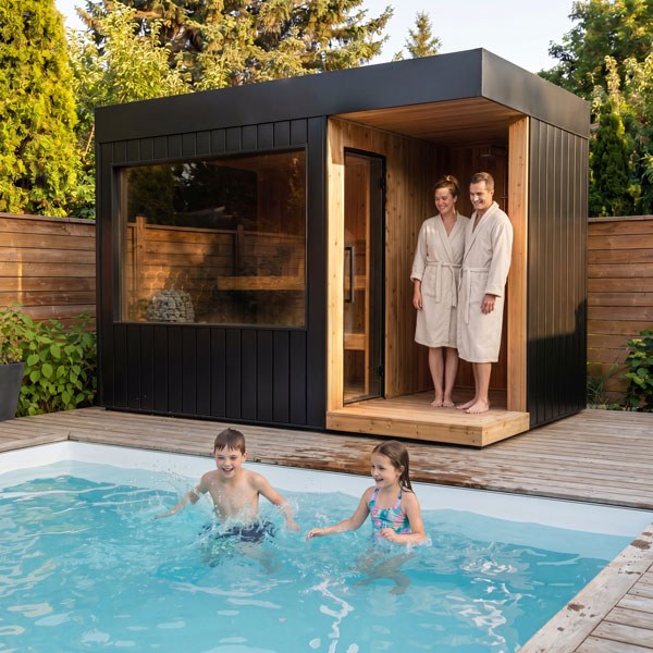 Astra Max with Shower Sauna beside a swimming pool, with two adults standing in the recessed shower entrance.