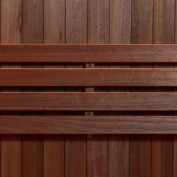 Element Studio indoor sauna close-up of the horizontal wood backrest and vertical wall panels.