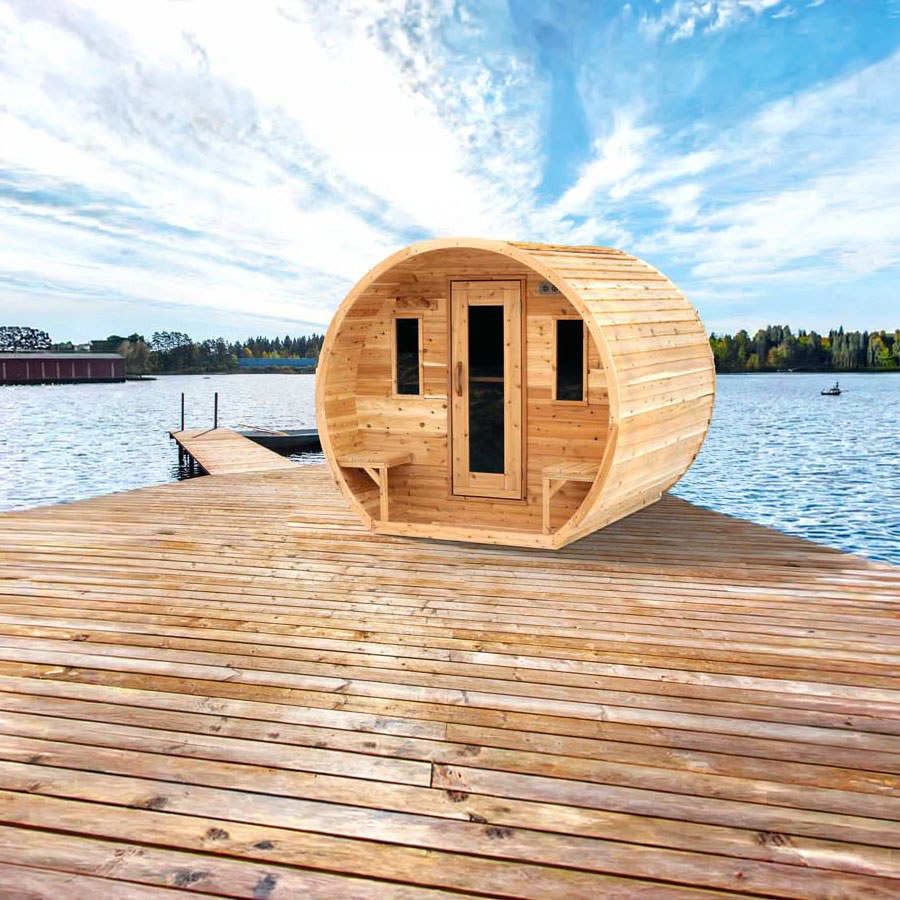 Elation barrel sauna with two front windows and a glass-panelled door on a lakeside dock.